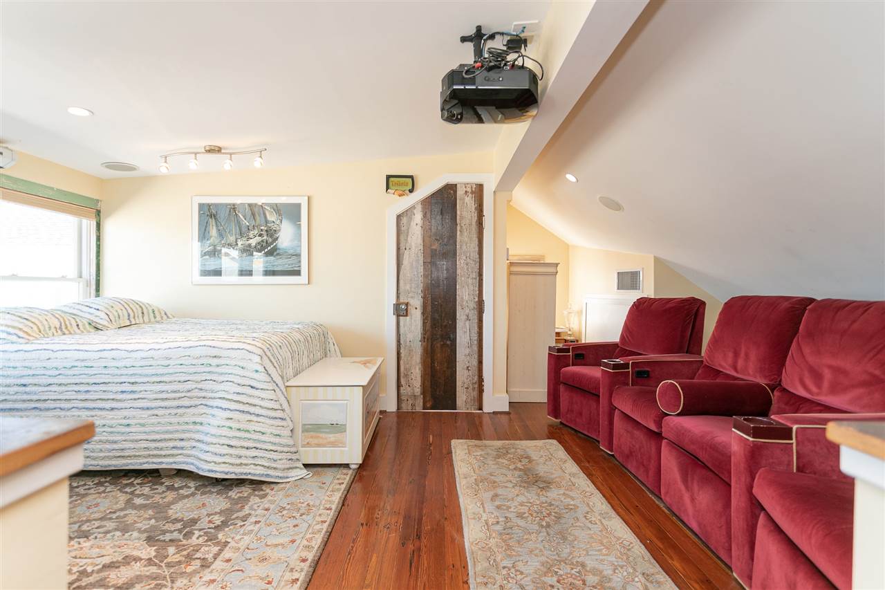 63 Marine Street St. Augustine, FL 32084 - Photo 30 of 42 a bedroom with a bed couch and a window