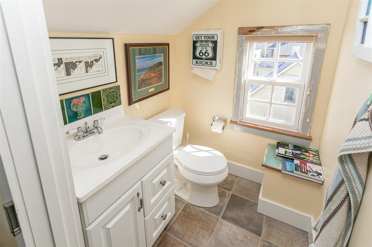 63 Marine Street St. Augustine, FL 32084 - Photo 31 of 42 a white toilet sitting next to a bathroom sink