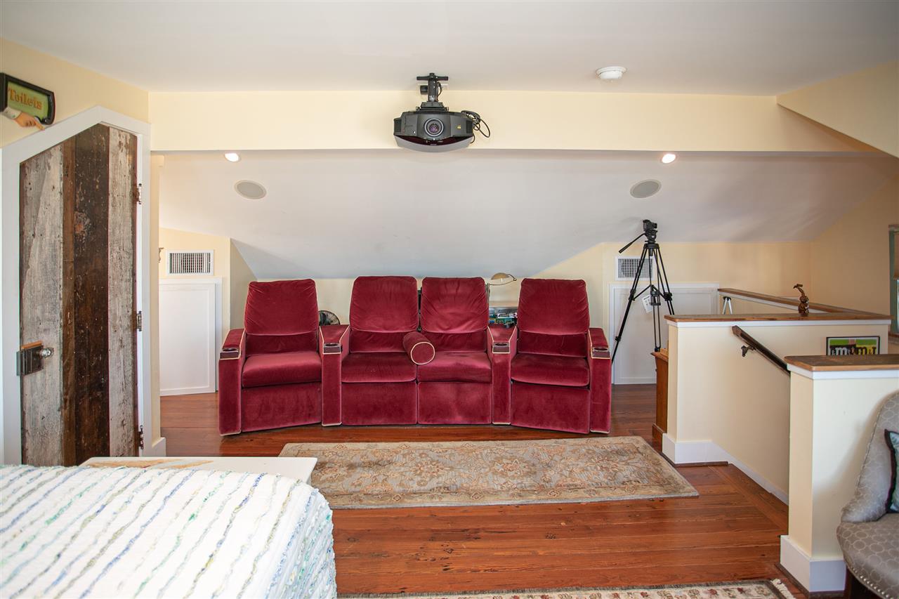 63 Marine Street St. Augustine, FL 32084 - Photo 35 of 42 a bedroom with a bed and a dresser