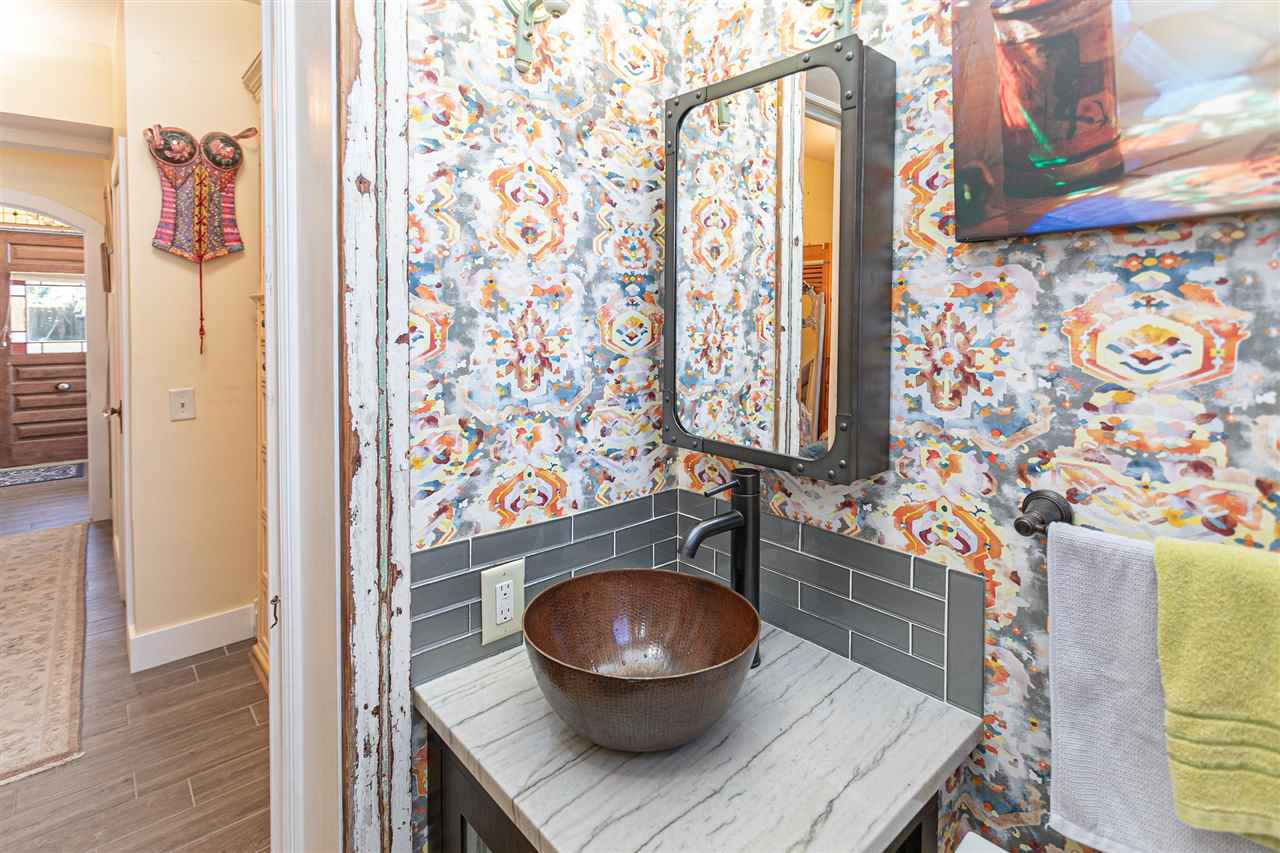 63 Marine Street St. Augustine, FL 32084 - Photo 7 of 42 a living room with a couch and a potted plant