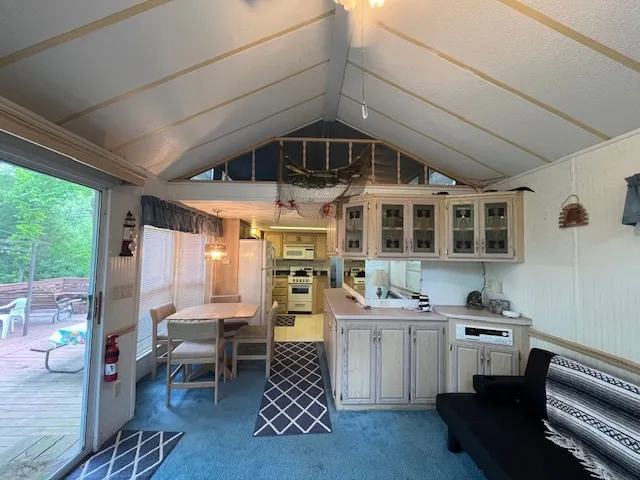 a kitchen with stainless steel appliances kitchen island granite countertop a sink and cabinets