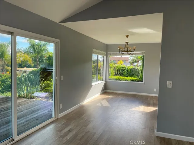 a view of a room with window wooden floor and garden