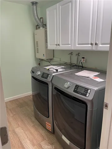 a white stove top oven sitting inside of a kitchen