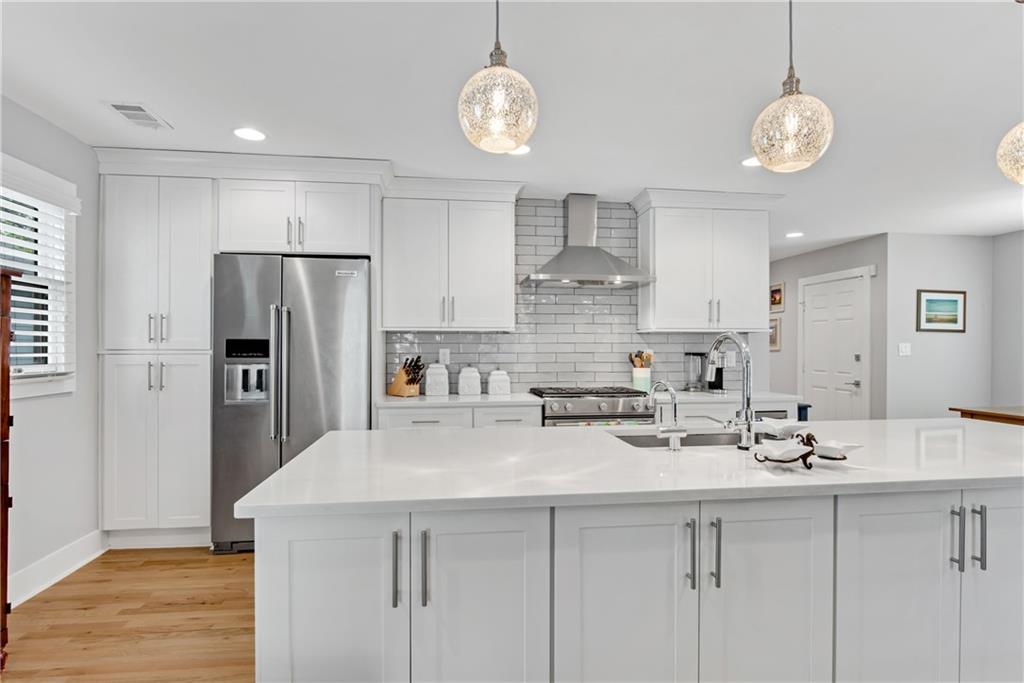 114 Tye Street Southeast Atlanta, GA 30316 - Photo 11 of 48 a kitchen with stainless steel appliances a sink a refrigerator center island and cabinets