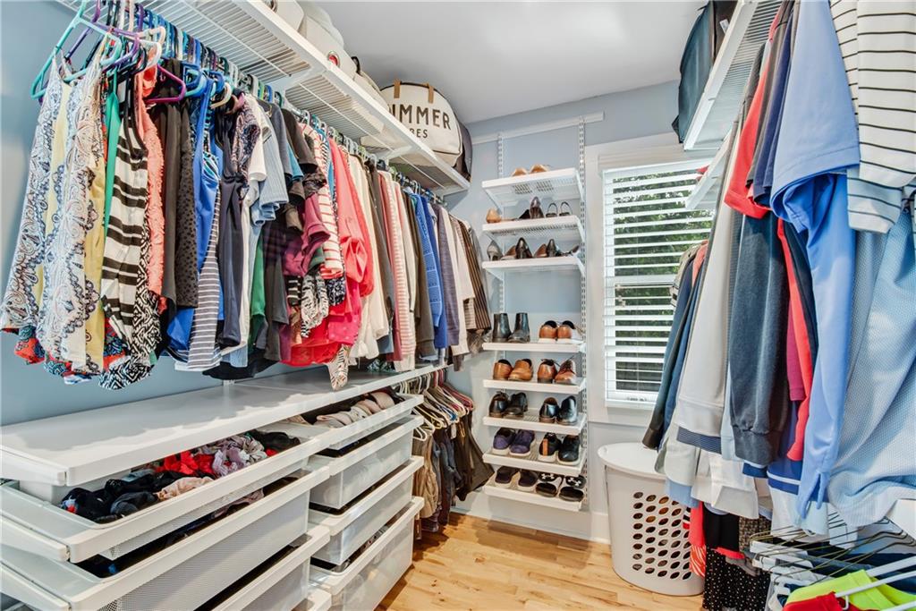 114 Tye Street Southeast Atlanta, GA 30316 - Photo 22 of 48 a view of walk in closet with clothes