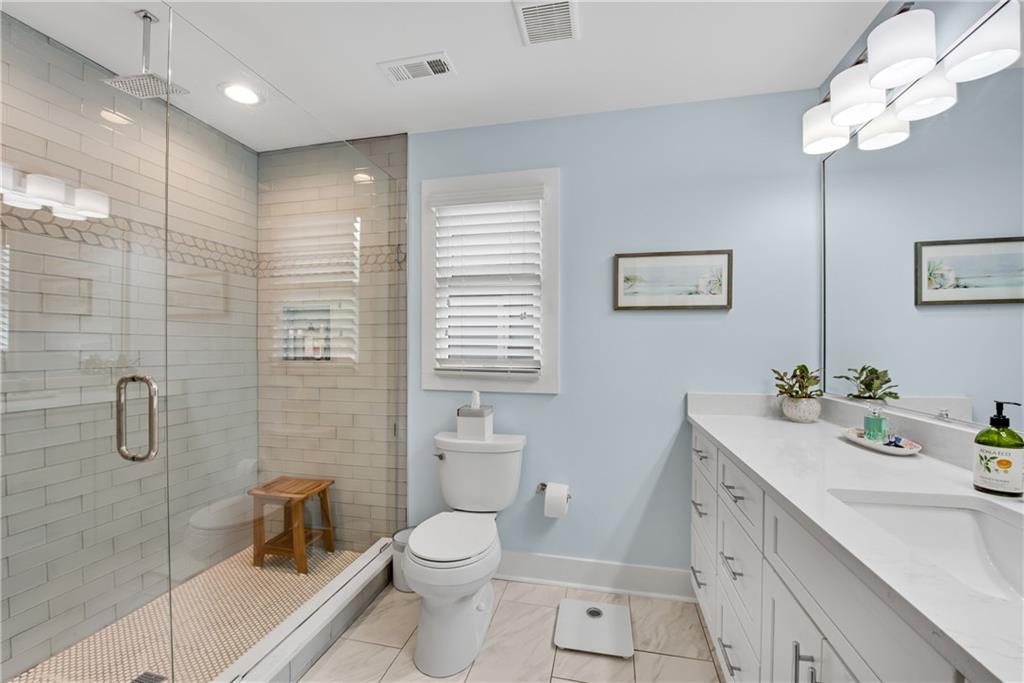 114 Tye Street Southeast Atlanta, GA 30316 - Photo 23 of 48 a bathroom with a sink a toilet and shower