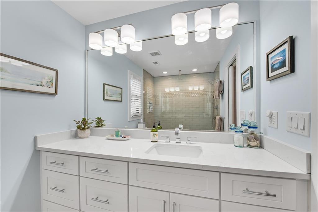 114 Tye Street Southeast Atlanta, GA 30316 - Photo 25 of 48 a bathroom with a sink mirror and vanity