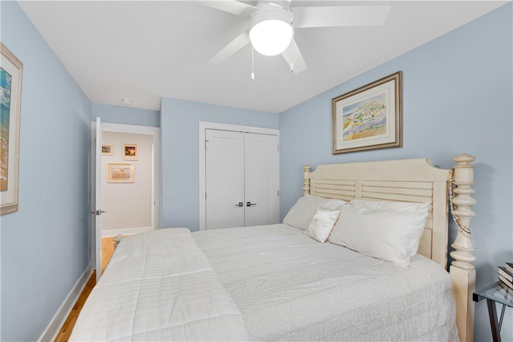 114 Tye Street Southeast Atlanta, GA 30316 - Photo 27 of 48 a bedroom with a bed and a chandelier