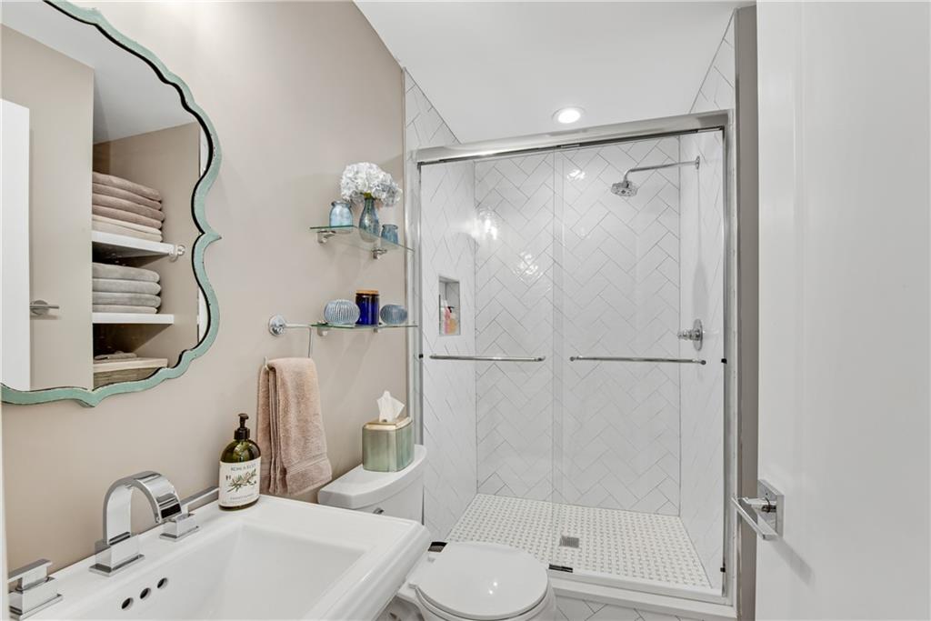 114 Tye Street Southeast Atlanta, GA 30316 - Photo 28 of 48 a bathroom with a shower sink vanity and toilet