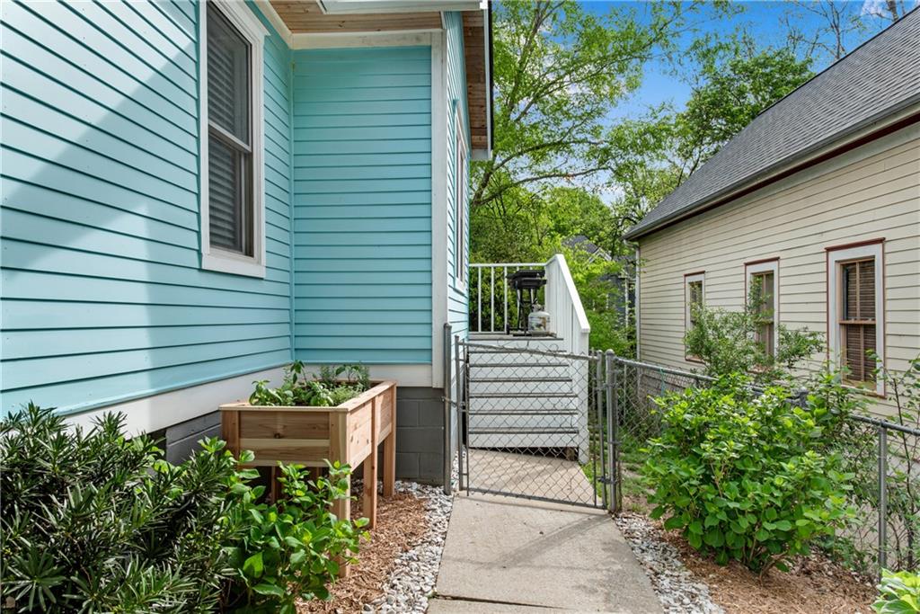 114 Tye Street Southeast Atlanta, GA 30316 - Photo 3 of 48 a house with a flower garden