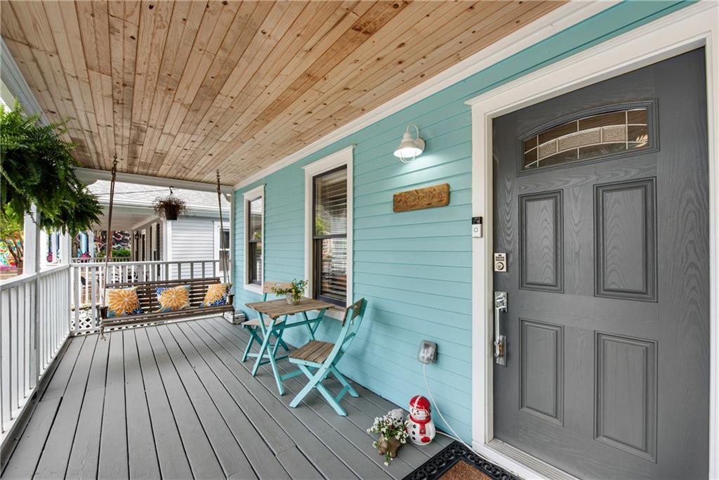 114 Tye Street Southeast Atlanta, GA 30316 - Photo 4 of 48 a balcony with furniture and wooden floor