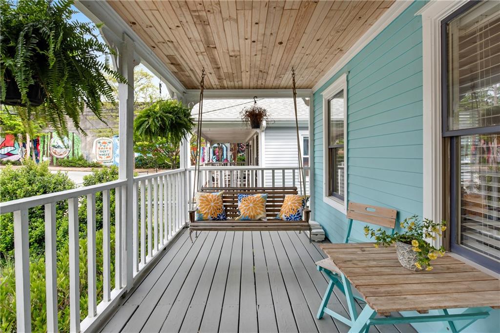 114 Tye Street Southeast Atlanta, GA 30316 - Photo 5 of 48 a balcony with wooden floor table and chairs