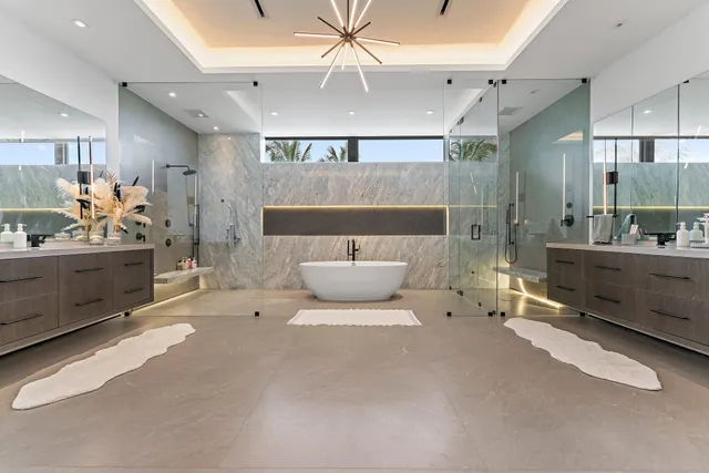 a bathroom with a toilet sink and shower