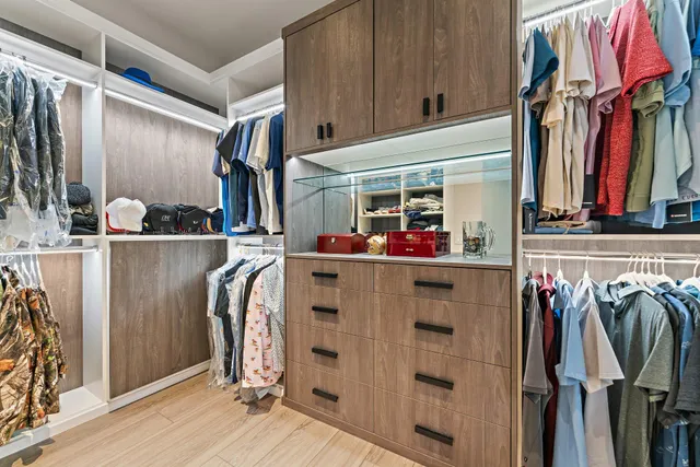 a view of a double vanity sink mirror and toilet