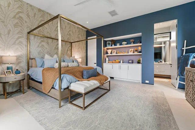 a living room with patio furniture and a floor to ceiling window