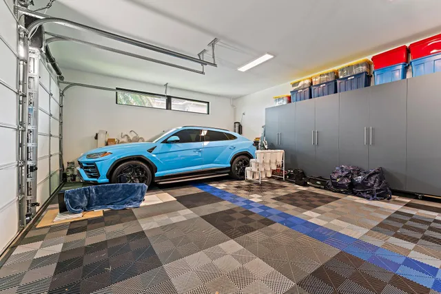 a view of an house with swimming pool and chairs