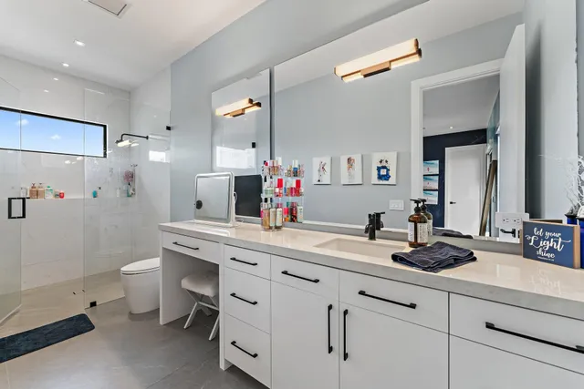 a living room with patio furniture and garden