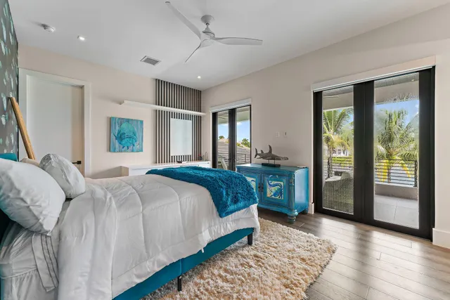 a view of a house with a yard patio and swimming pool