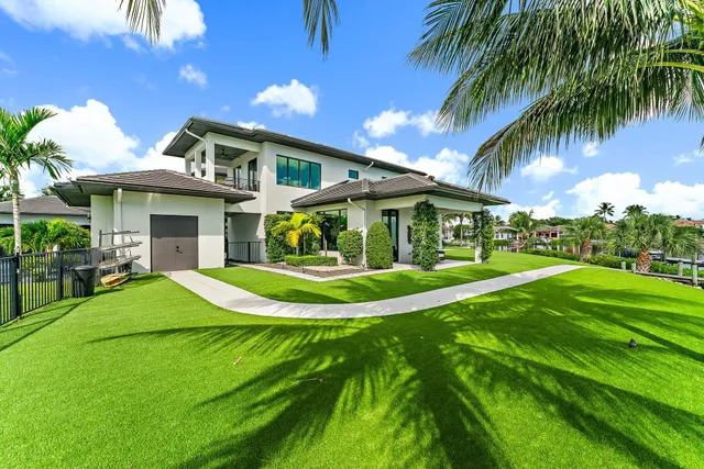 a front view of house with yard and outdoor seating