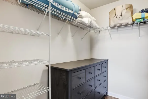 a bedroom with a bed and a table in it