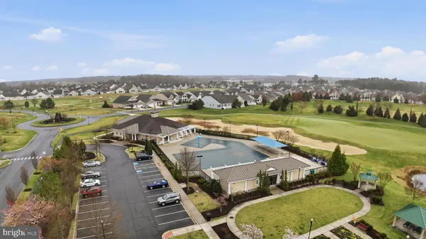 an aerial view of a house with a big yard