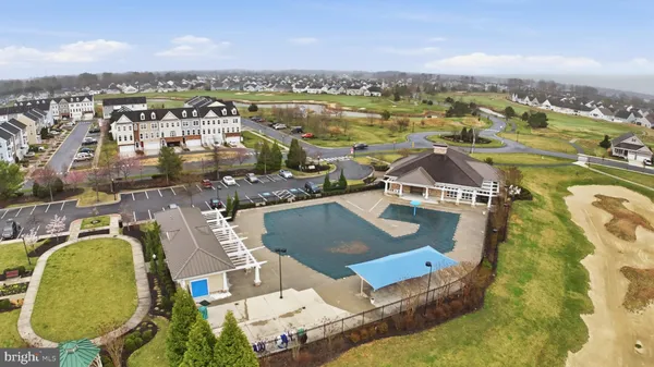 an aerial view of a house with outdoor space