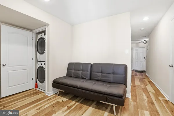 a living room with furniture and a rug