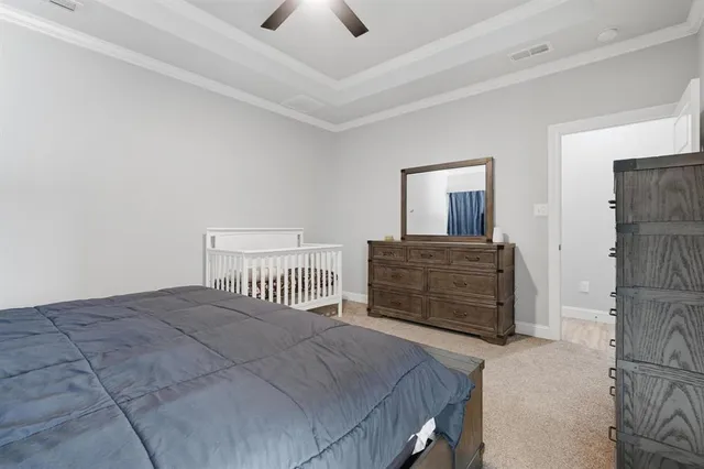 a bedroom with a bed and chair