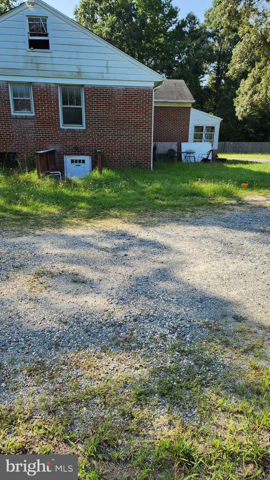 4499 Leonardtown Road Waldorf, MD 20601 - Photo 6 of 11 a front view of a house with garden