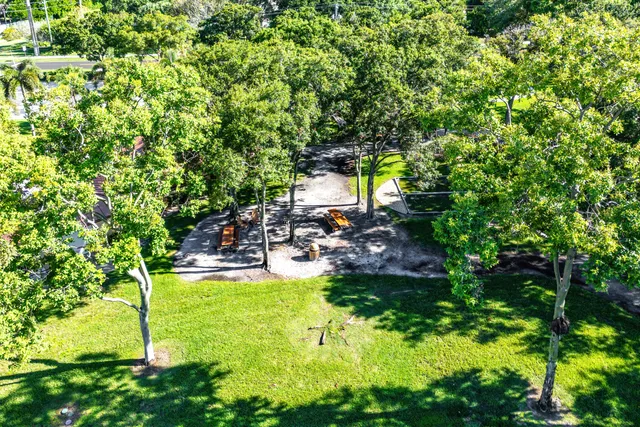 a view of a swimming pool with a yard