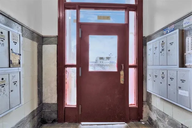 a view of hallway with mirror
