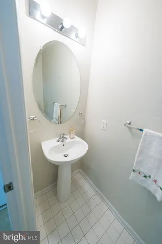 a bathroom with a sink and mirror