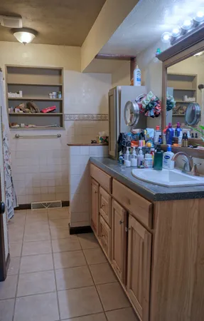 a kitchen with a sink stove and cabinets