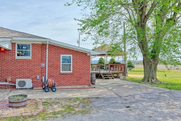 a front view of a house with a yard table and chairs