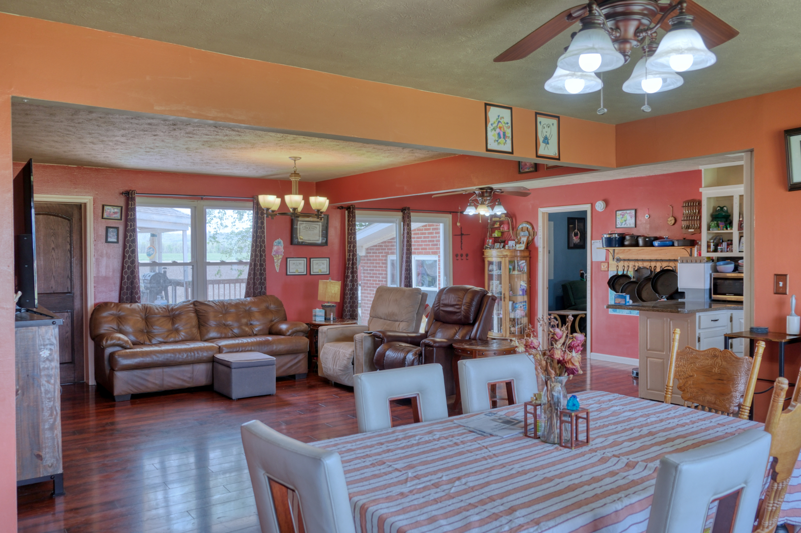 3992 Neunert Road Jacob, IL 62950 - Photo 4 of 48 a view of a dining room with furniture a chandelier and wooden floor