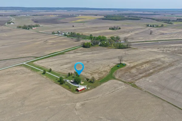 a aerial view of a house with a yard