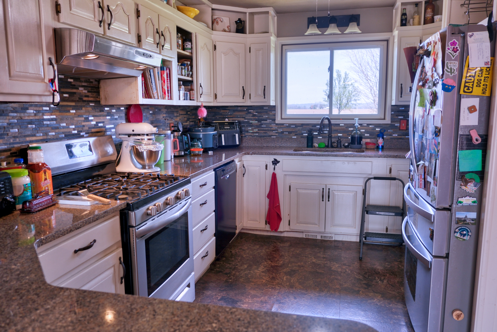 3992 Neunert Road Jacob, IL 62950 - Photo 9 of 48 a kitchen with stainless steel appliances granite countertop a stove a sink and a microwave