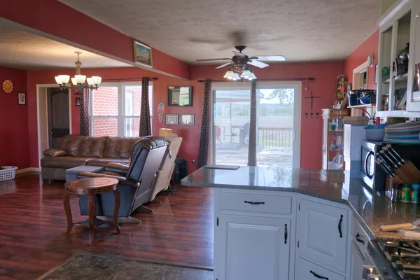 a view of a livingroom with furniture window and wooden floor