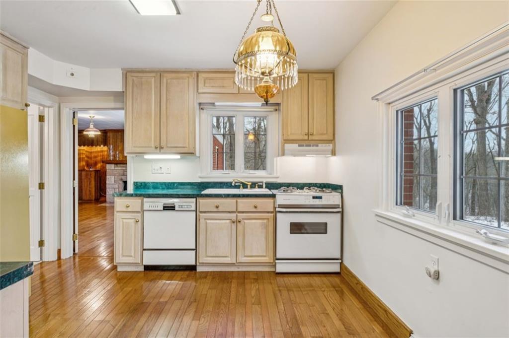 2508 Woodbine Road Aliquippa, PA 15001 - Photo 12 of 46 a kitchen with stainless steel appliances granite countertop a stove a sink and a refrigerator