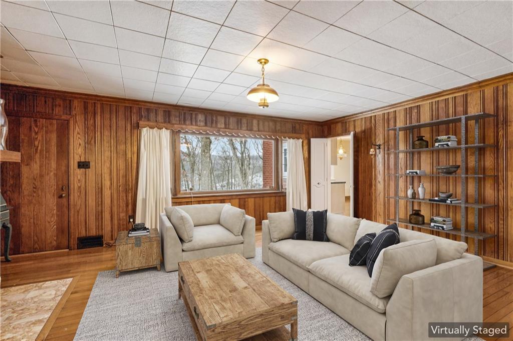 2508 Woodbine Road Aliquippa, PA 15001 - Photo 13 of 46 a living room with furniture a ceiling fan and a window