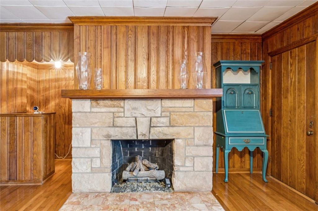 2508 Woodbine Road Aliquippa, PA 15001 - Photo 15 of 46 a living room with a fireplace furniture and a large window