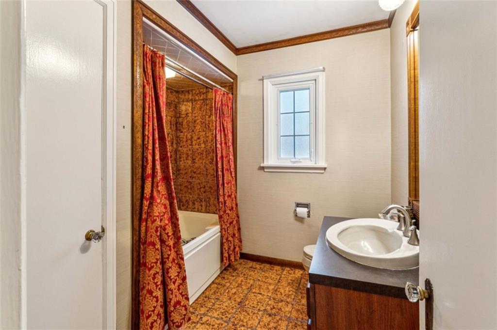 2508 Woodbine Road Aliquippa, PA 15001 - Photo 25 of 46 a bathroom with a sink a toilet and a mirror