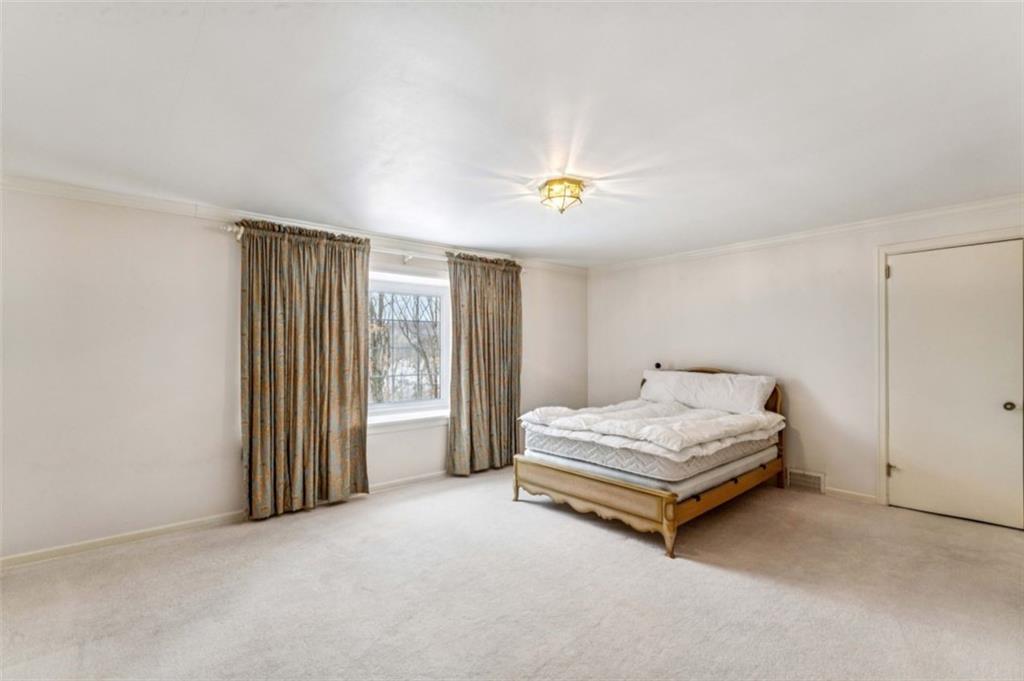2508 Woodbine Road Aliquippa, PA 15001 - Photo 26 of 46 a spacious bedroom with a bed and a window