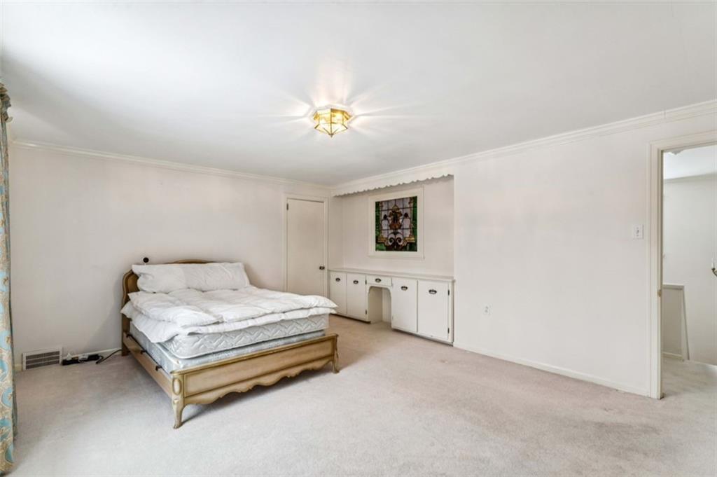 2508 Woodbine Road Aliquippa, PA 15001 - Photo 27 of 46 a bedroom with a bed and a table