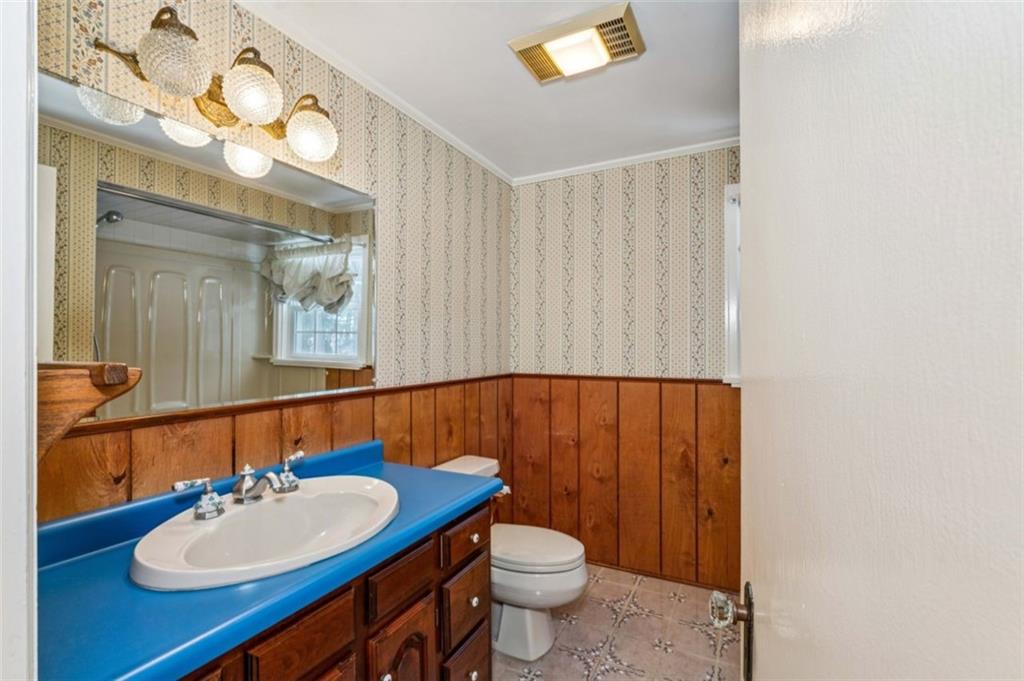 2508 Woodbine Road Aliquippa, PA 15001 - Photo 30 of 46 a bathroom with a sink vanity mirror and toilet