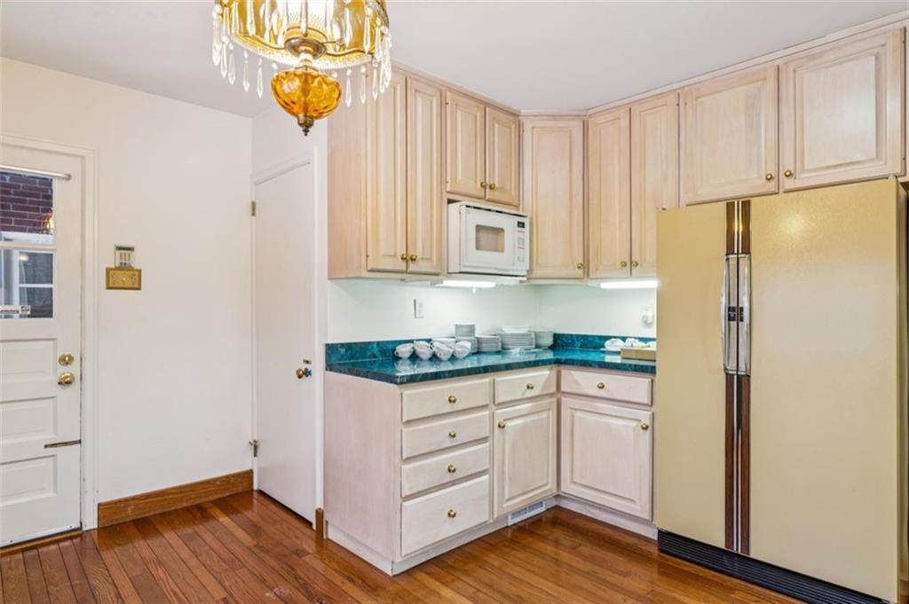 2508 Woodbine Road Aliquippa, PA 15001 - Photo 10 of 46 a kitchen with stainless steel appliances granite countertop a refrigerator and a stove top oven