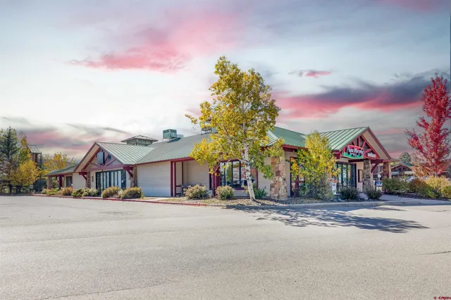 a view of road with houses