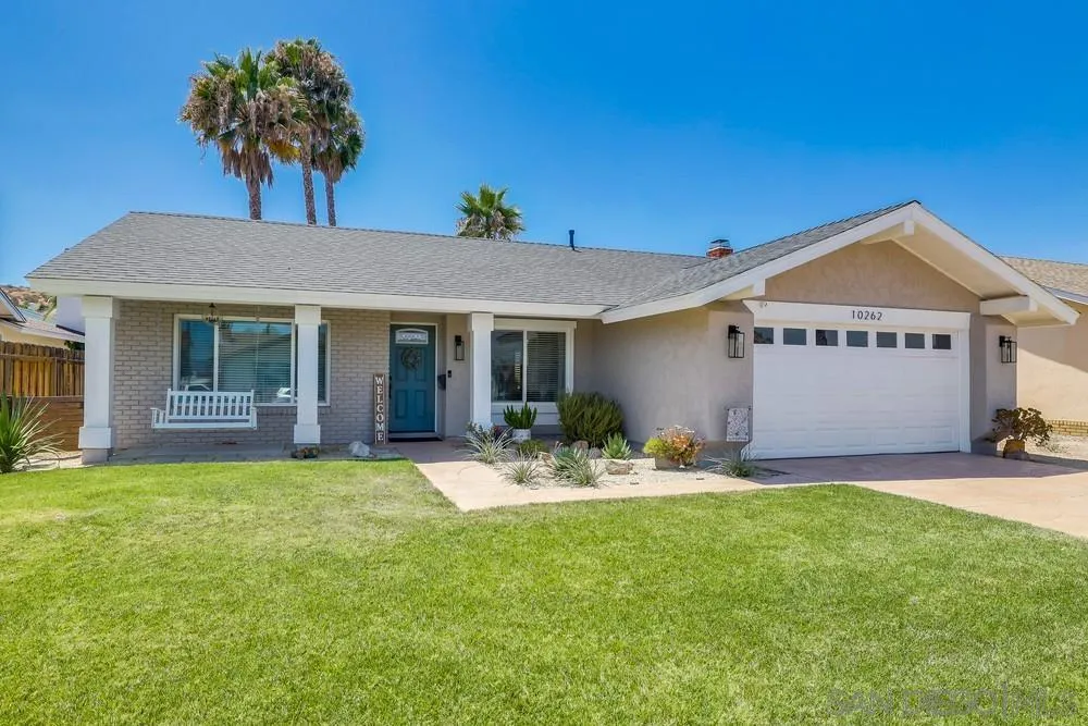10262 Molino Road Santee, CA 92071 - Photo 1 of 26 a front view of a house with a garden and patio