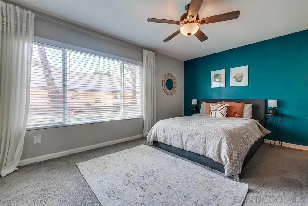 10262 Molino Road Santee, CA 92071 - Photo 15 of 26 a bedroom with a large bed and a window