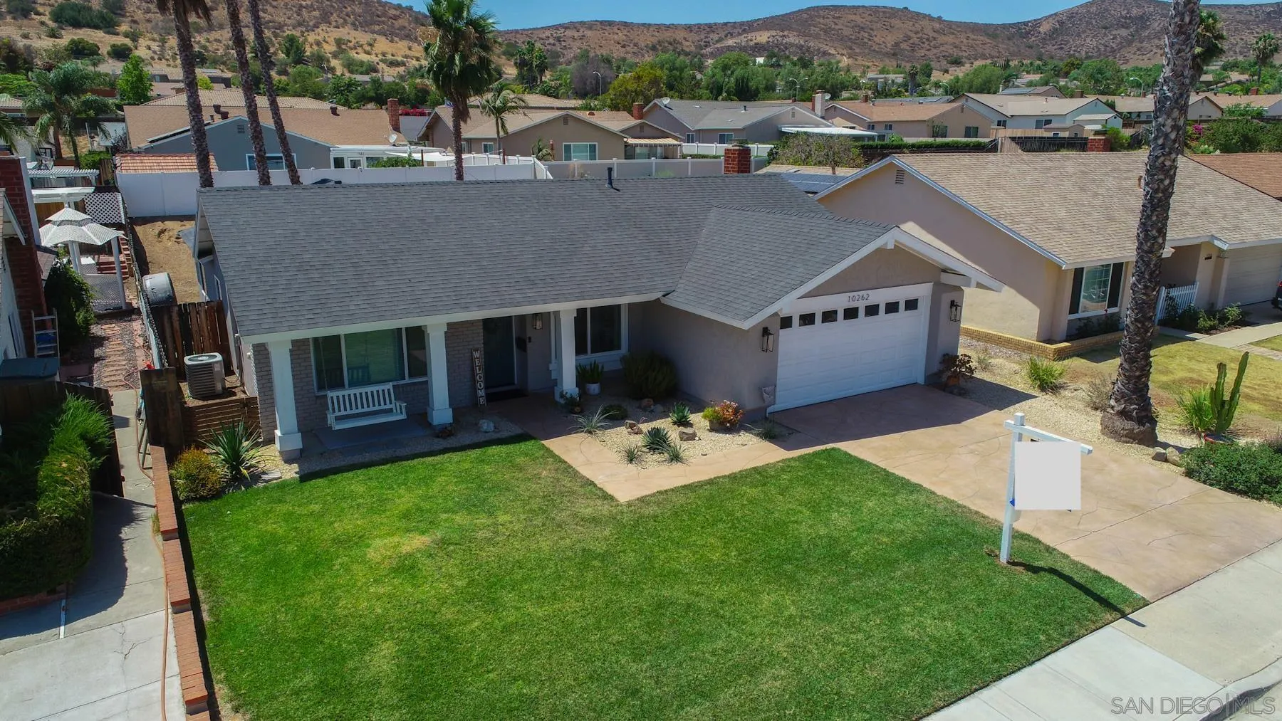 10262 Molino Road Santee, CA 92071 - Photo 25 of 26 an aerial view of a house with a garden and a yard